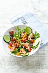 Healthy Salad with Chicken Breast, Cherry Tomatoes, Cucumber, Orange Pepper, Endive and Red Onion.