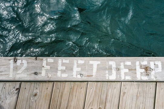 edge of dock says ""12 feet deep""