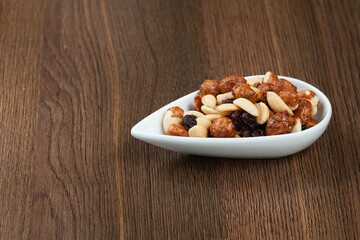 Healthy And Tasty Snack; Mixture of peanuts, raisins, and peanuts Covered With Honey.