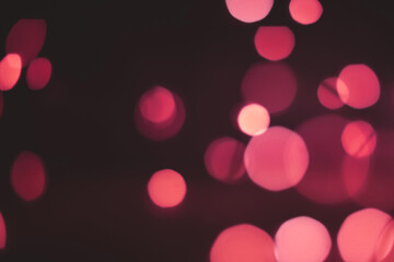 Defocused abstract pink and red color bokeh lights background. christmas and new year concept .copy space