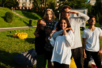 Young multi ethnic group of people in open air cinema.