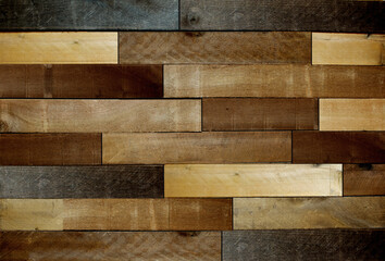 background - Various old and rustic stained pine boards laid out in a parquet pattern.
