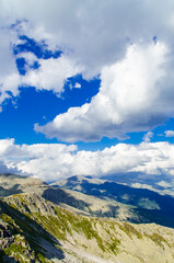 Naklejka premium View from high mountain. clouds in the sky