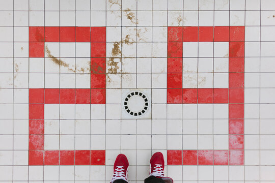 Red Shoes on Red and White Tiles