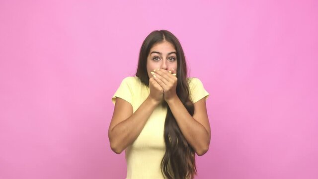 Young caucasian woman shocked covering mouth with hands