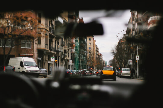 View following taxi cab through european city street