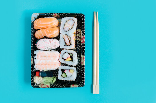 Mix of Sushi Take Away on a Blue Background