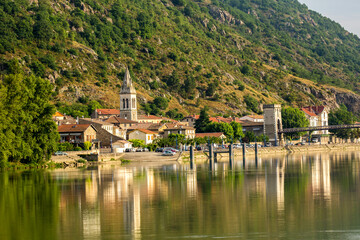 Fototapeta premium A bridge across tghe Rhone River and the commune of Andance, France