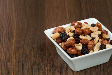 Healthy And Tasty Snack; Mixture of peanuts, raisins, and peanuts Covered With Honey.
