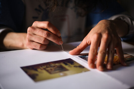 Female hands binding book