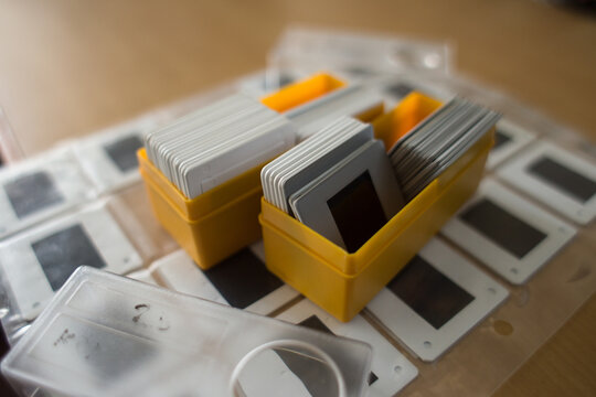 Bunch of old slides on a table.