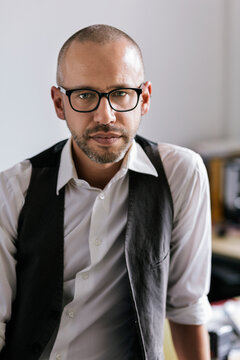 Businessman with attitude wearing eyeglasses in office