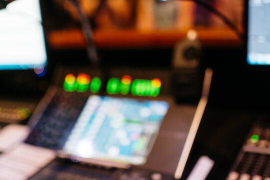 Out of focus mixer board at a live performance