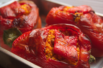 Closeup of some red peppers stuffed with rice