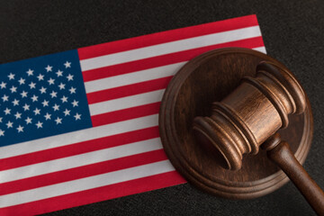 Judge gavel near the US flag. Law and legality in United States of America. Violation of human...