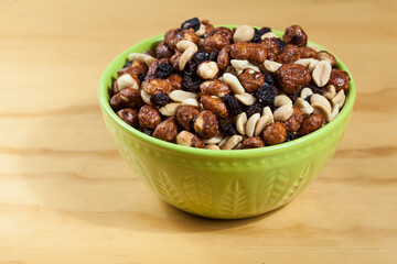 Healthy And Tasty Snack; Mixture of peanuts, raisins, and peanuts Covered With Honey.
