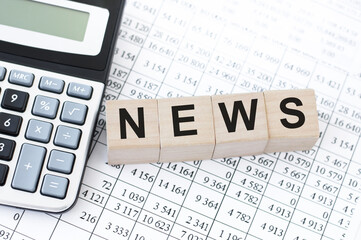 Wooden news sign on a table in an office