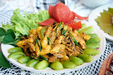 Smoked dry fish with spicy seasoning. Asian Traditional seafood menu