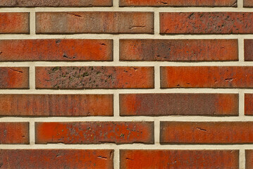 Texture of brick wall. new brickwork. Samples of wall or fence are presented at exhibitions. Orange brick close up.