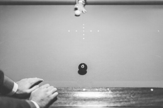 Playing Billiards in a Pool Table