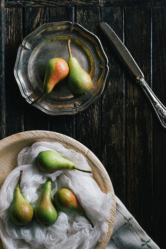 Pears on Dark Wooden Table