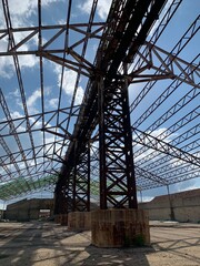 Territory of a closed abandoned salt factory. Impressive atmosphere of decline and decadence. Industrial apocalyptic landscape. Shadows on the floor.