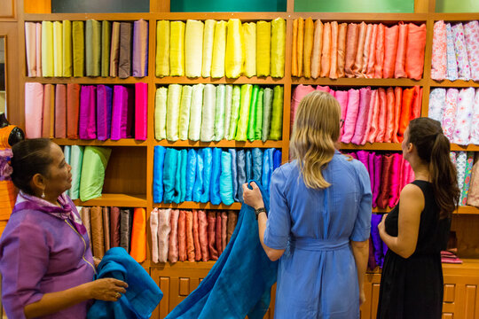 Ladies in an exotic fabric store