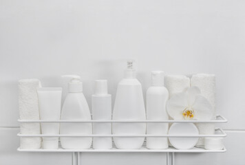 White bottles of cosmetic beauty products in bath