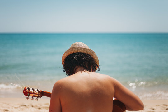 Playing guitar on the beach