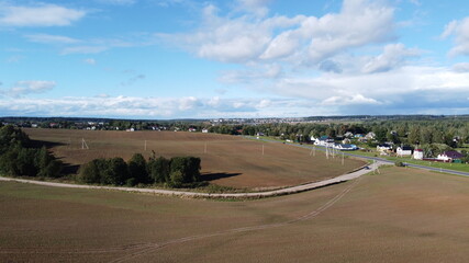 Top view of an asphalt road in the fields