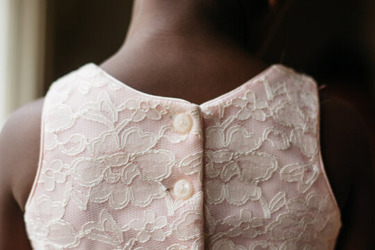 Back of an African American girl in pink dress