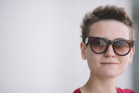 portrait of real young woman with sunglasses