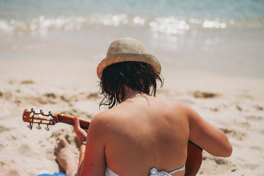 Playing guitar on the beach