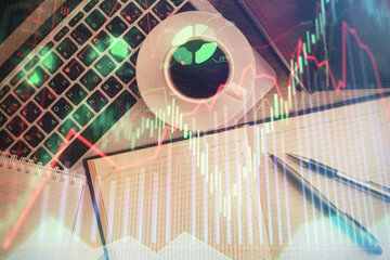 Stock market chart and top view computer on the table background. Double exposure. Concept of financial analysis.
