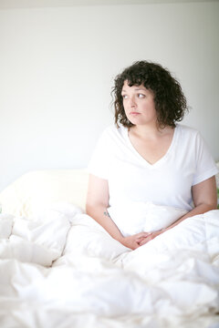 Woman sitting in bed