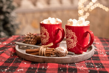Hot cocoa with marshmallows in a Christmas cup. Hot chocolate wiht white marshmalows in a New Year's cup. New Year 2020.