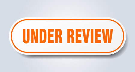 under review sign. rounded isolated button. white sticker