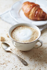 Coffee with milk on bright stone background. Close up.	