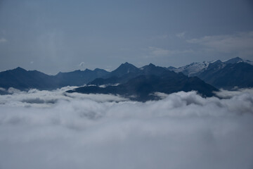 Fototapeta na wymiar Mountain panorama of the Austrian Alps with low clouds