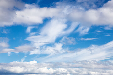 Obraz premium Beautiful View of Puffy White Clouds with blue Sky in Background during a sunny summer day. Taken in Yukon, Canada.