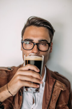 Man drinking beer in a bar.