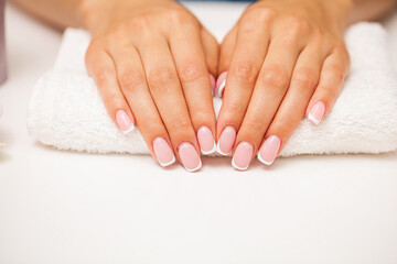 Naklejka premium The picture of female hands with perfectly done manicure.