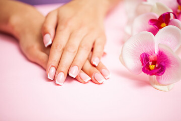 The picture of female hands with perfectly done manicure.