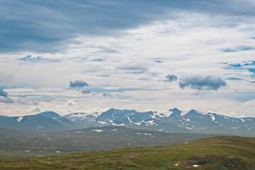 Storulvån (Sweden). View of partially snow-capped mountain peaks.