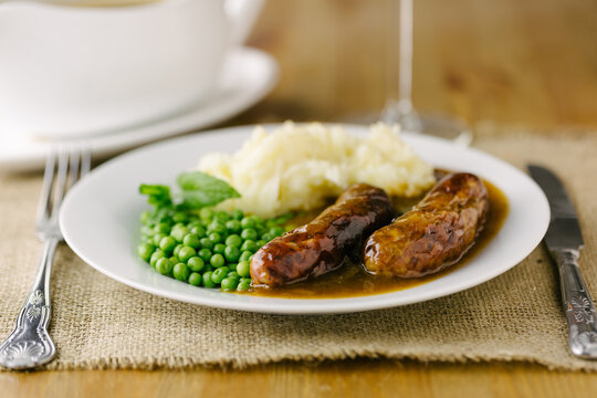 Bangers (sausages) and mash with onion gravy