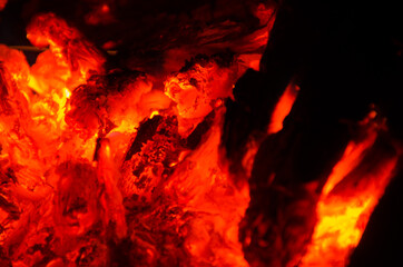 embers burn down in a hardwood fire - 380448524
