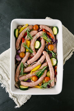 Uncooked Roasted vegetable and sausage dish
