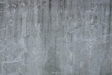 gray stone texture from dirty old concrete wall in a fence on the street