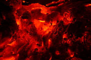 Fototapeta na wymiar embers burn down in a hardwood fire