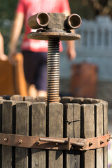 Winepress with red must and helical screw. Production of traditional Italian wines, crushing of grapes.